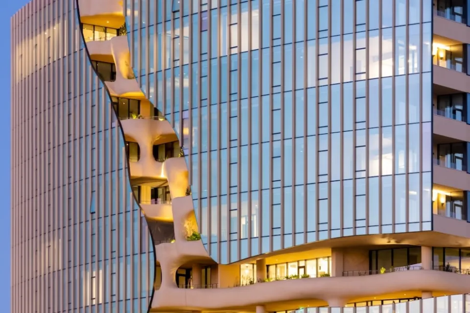 'Vertical canyon' on glass-clad residential high-rise in Denver, CO.